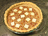  Placed each type of the chocolate pieces on top of the pie, one at a time to ensure they are evenly distributed